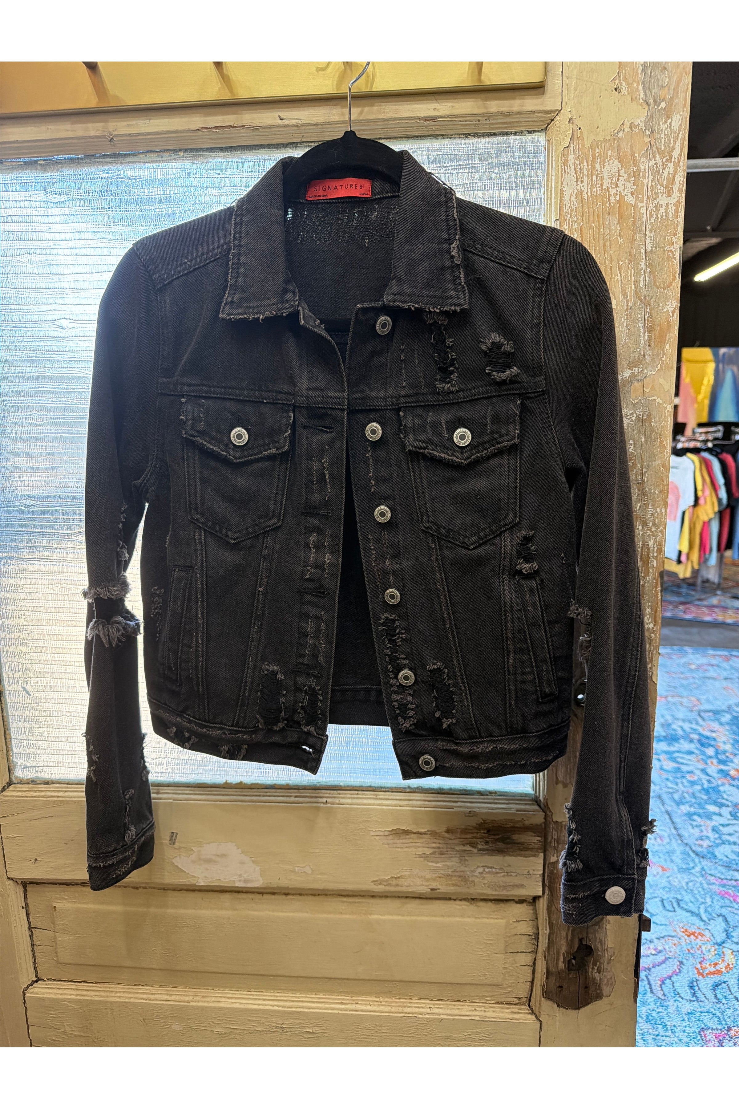 Distressed denim jacket